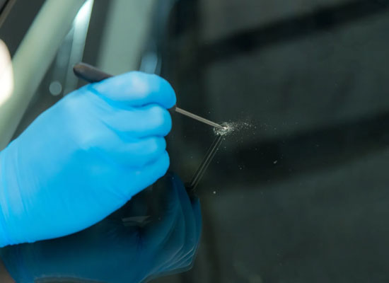 Windshield chip repair in progress at Zoz Auto Detailing Rochester MN